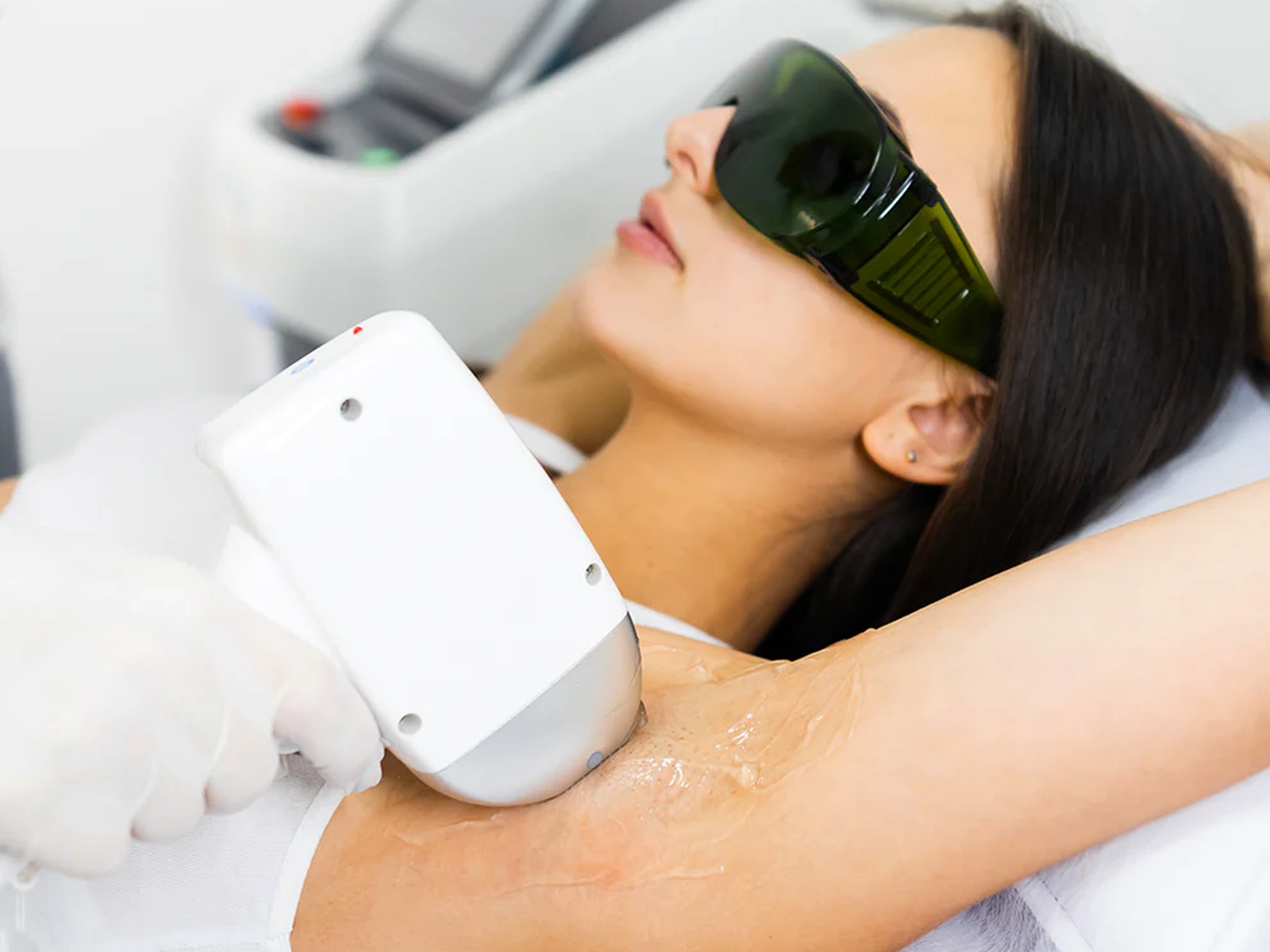 Professional diode laser hair removal treatment on the underarm